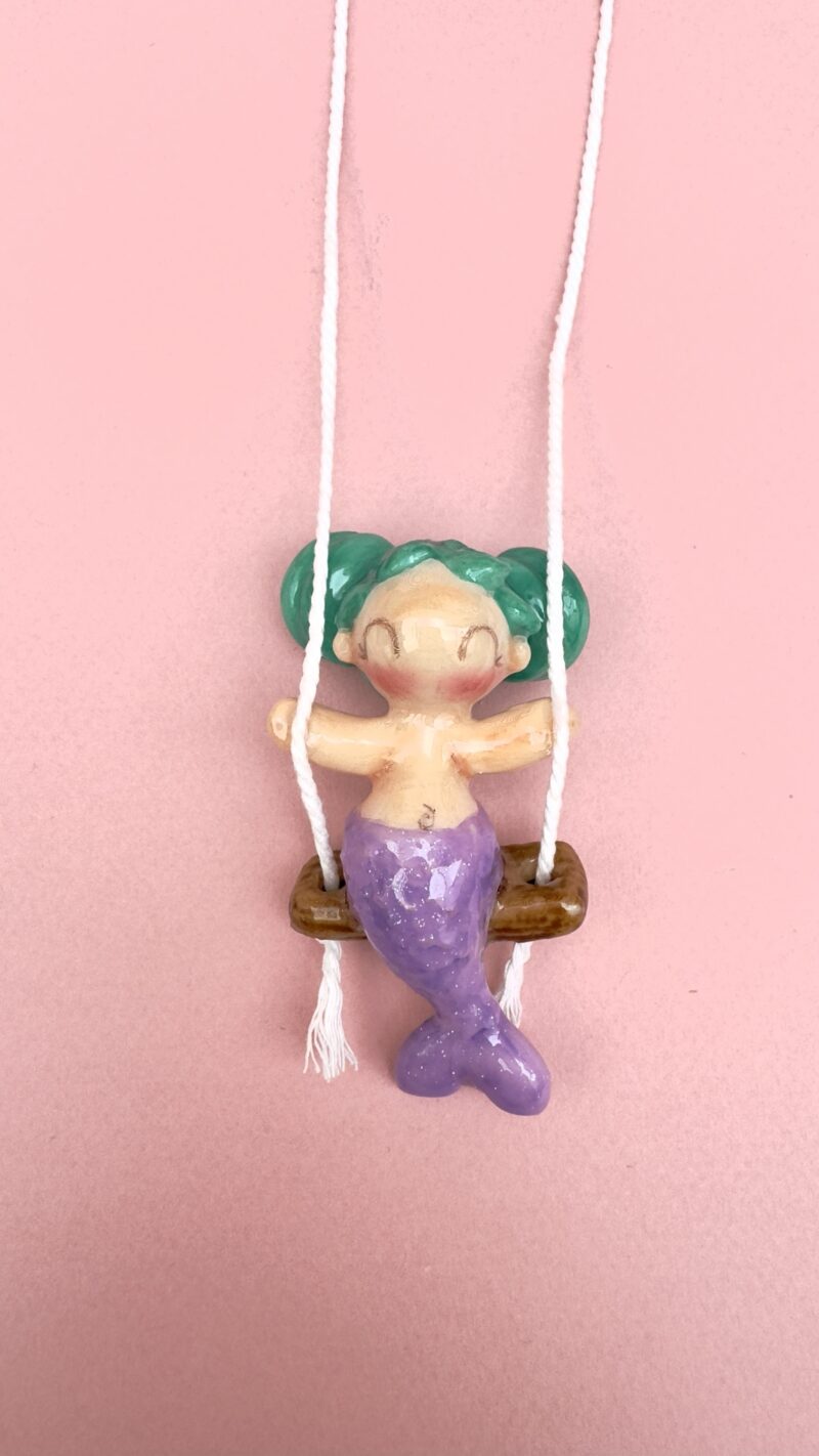 Colgante sirena en columpio moños